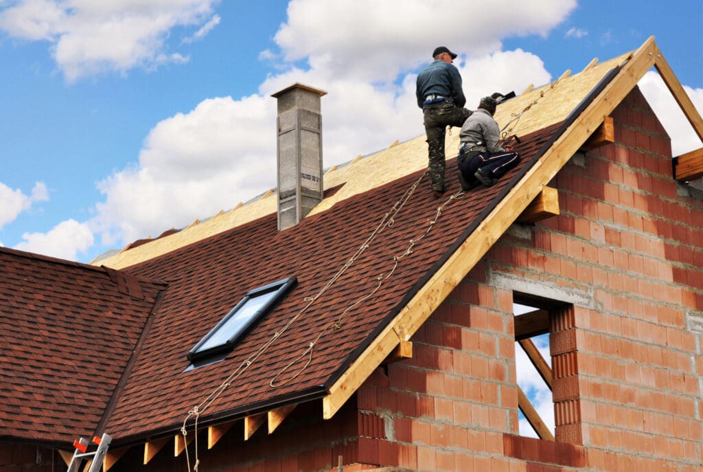 Roofers lay and install asphalt shingles